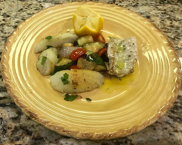 GRILLED WOLF FISH WITH FRESH THYME ON MEDITERRANEAN VEGETABLES